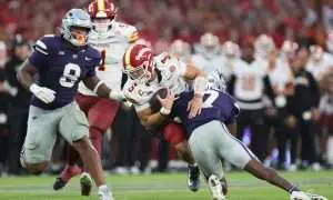 Aug 23, 2025; Dublin, IRELAND; Iowa State quarterback Rocco Becht is tackled by VJ Payne of Kansas State during the Aer Lingus Classic between Iowa State and Kansas State at Aviva Stadium. Mandatory Credit: Laszlo Geczo/INPHO via Imagn Images