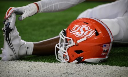 Dec 4, 2021; Arlington, TX, USA; A view of an Oklahoma State Cowboys helmet and logo as the Cowboys warm up before the game against the Baylor Bears during the Big 12 Conference championship game at AT&T Stadium. Mandatory Credit: Jerome Miron-USA TODAY Sports