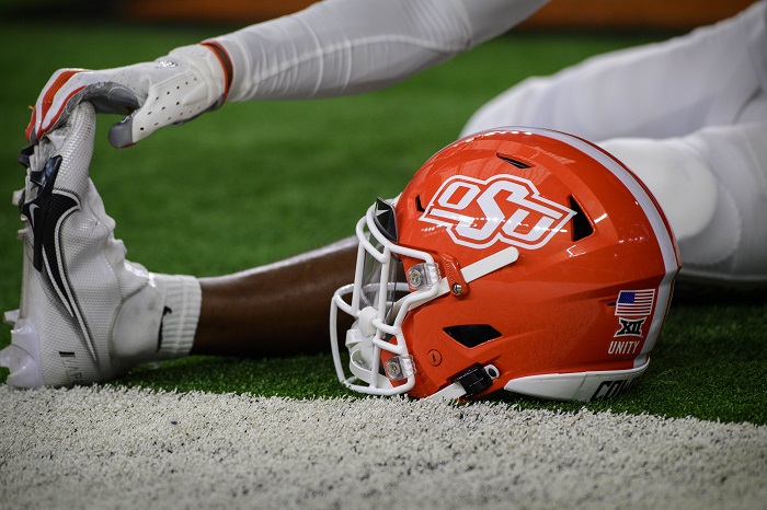 Dec 4, 2021; Arlington, TX, USA; A view of an Oklahoma State Cowboys helmet and logo as the Cowboys warm up before the game against the Baylor Bears during the Big 12 Conference championship game at AT&T Stadium. Mandatory Credit: Jerome Miron-USA TODAY Sports