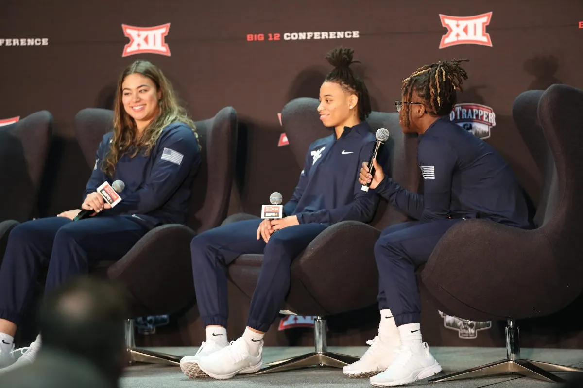 Kyah Watson, JJ Quinerly and Madisen Smith of the West Virginia Mountaineers. (Big 12 photo by Ryan Weaver)