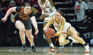 Oklahoma State's Kassidy De Lapp and Texas' Shay Holle.