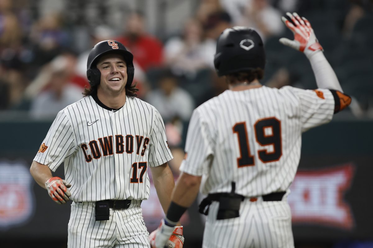 Oklahoma State's Tyler Wulfert and Marcus Brown. (Big 12 Photo by Tim Heitman)