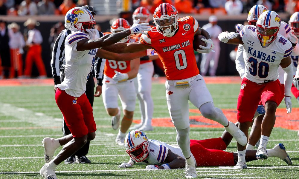 Oct 14, 2023; Stillwater, Oklahoma, USA; Oklahoma State's Ollie Gordon II (0) runs the ball in the second quarter for a touchdown against the Kansas Jayhawks at Boone Pickens Stadium. Mandatory Credit: Nathan J. Fish-USA TODAY Sports