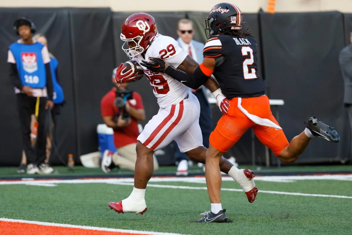 Oklahoma Sooners running back Tawee Walker (29) runs past Oklahoma State Cowboys cornerback Korie Black (2) for a touchdown during a Bedlam college football game between the Oklahoma State University Cowboys (OSU) and the University of Oklahoma Sooners (OU) at Boone Pickens Stadium in Stillwater, Okla., Saturday, Nov. 4, 2023. Oklahoma State won 27-24.