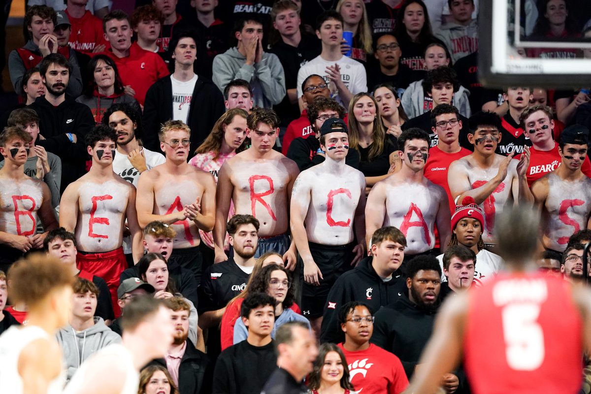 The Cincinnati Bearcats students cheer on the team in the first half of a men’s college basketball game between the Illinois-Chicago Flames and the Cincinnati Bearcats, Monday, Nov. 6, 2023, at Fifth Third Arena in Cincinnati.