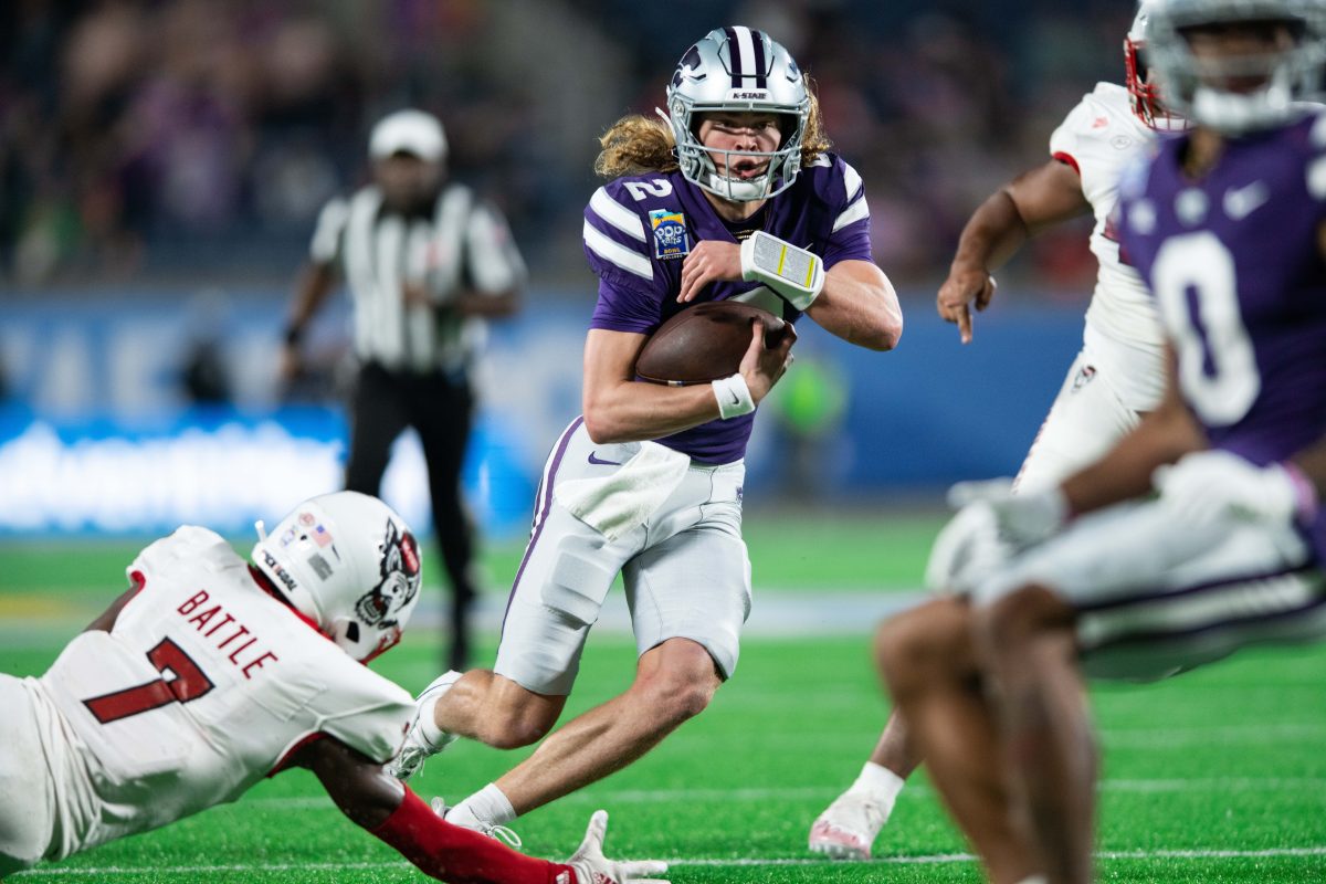 Dec 28, 2023; Orlando, FL, USA; Kansas State quarterback Avery Johnson (2) runs for the touchdown against NC State in the second quarter at Camping World Stadium. Mandatory Credit: Jeremy Reper-USA TODAY Sports