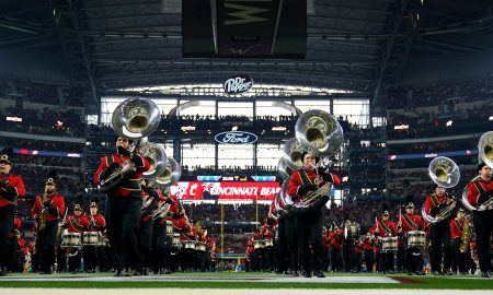 The Cincinnati Bearcats dance team stands for the national anthem ahead of the College Football Playoff semifinal game between the Cincinnati Bearcats and the Alabama Crimson Tide at the 86th Cotton Bowl Classic, Friday, Dec. 31, 2021, at AT&T Stadium in Arlington, Texas.