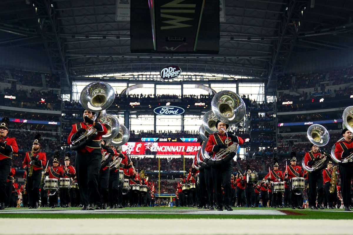 The Cincinnati Bearcats dance team stands for the national anthem ahead of the College Football Playoff semifinal game between the Cincinnati Bearcats and the Alabama Crimson Tide at the 86th Cotton Bowl Classic, Friday, Dec. 31, 2021, at AT&T Stadium in Arlington, Texas.