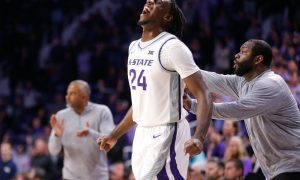 Kansas State junior transfer wing Arthur Kaluma (24) yells out after graduate transfer guard Tylor Perry (2) scores over Oral Roberts in overtime of Tuesday's game inside Bramlage Coliseum.