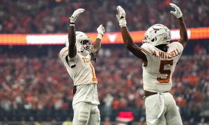 Big 12: Texas Longhorns wide receivers Adonai Mitchell (5) and Xavier Worthy (1) celebrate a touchdown by Mitchell.