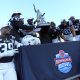 Dec 23, 2023; Birmingham, AL, USA; Duke Blue Devils players and interim head coach Trooper Taylor celebrate with the Birmingham Bowl trophy after defeating the Troy Trojans at Protective Stadium. Mandatory Credit: Petre Thomas-USA TODAY Sports