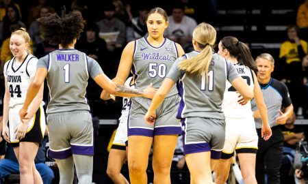 Kansas State center Ayoka Lee (50) is greeted by teammates Zyanna Walker, left, and Taryn Sides during NCAA women's basketball game against Iowa, Thursday, Nov. 16, 2023, at Carver-Hawkeye Arena in Iowa City, Iowa.