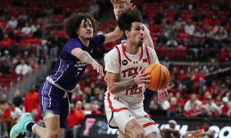 Jan 1, 2024; Lubbock, Texas, USA; Texas Tech Red Raiders guard Pop Isaacs (2) stops to take a shot against North Alabama Lions guard KJ Johnson (3) in the first half at United Supermarkets Arena. Mandatory Credit: Michael C. Johnson-USA TODAY Sports
