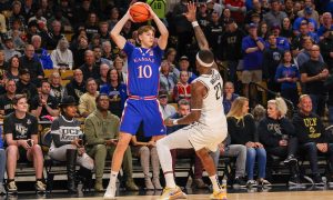 Jan 10, 2024; Orlando, Florida, USA; Kansas Jayhawks guard Johnny Furphy (10) looks to pass during the first period against the UCF Knights at Addition Financial Arena. Mandatory Credit: Mike Watters-USA TODAY Sports