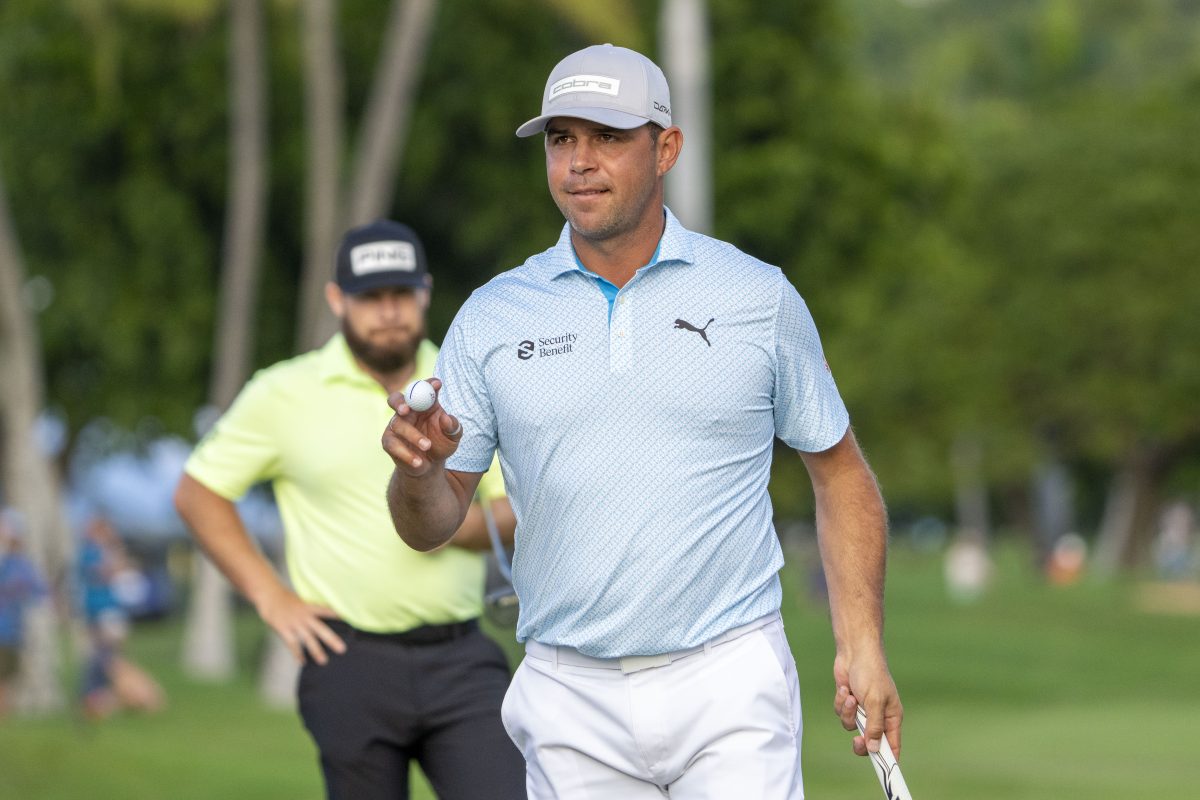 January 12, 2024; Honolulu, Hawaii, USA; Gary Woodland acknowledges the crowd after making his putt on the 18th hole during the second round of the Sony Open in Hawaii golf tournament at Waialae Country Club. Mandatory Credit: Kyle Terada-USA TODAY Sports