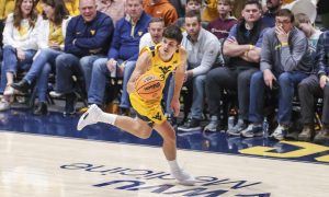 Jan 13, 2024; Morgantown, West Virginia, USA; West Virginia Mountaineers guard Kerr Kriisa (3) dribbles up the floor during the second half against the Texas Longhorns at WVU Coliseum. Mandatory Credit: Ben Queen-USA TODAY Sports