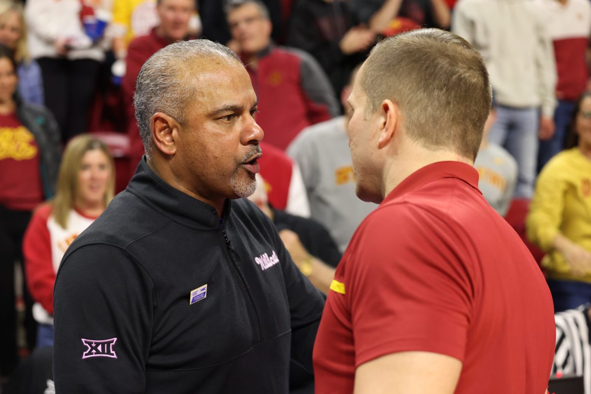 Jan 24, 2024; Ames, Iowa, USA; Kansas State Wildcats head coach Jerome Tang and Iowa State Cyclones head coach T.J. Otzelberger meet after their game at James H. Hilton Coliseum. Mandatory Credit: Reese Strickland-USA TODAY Sports