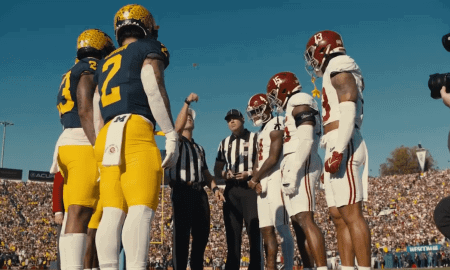 Michigan and Alabama players await the coin toss at the 2024 Rose Bowl.