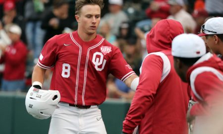 John Spikerman is greeted after a score as the University of Oklahoma Sooners (OU) play the Oklahoma State Cowboys (OSU) in Bedlam baseball on May 19, 2023 at L Dale Mitchell Park in Norman, Okla. [Steve Sisney/For The Oklahoman]
