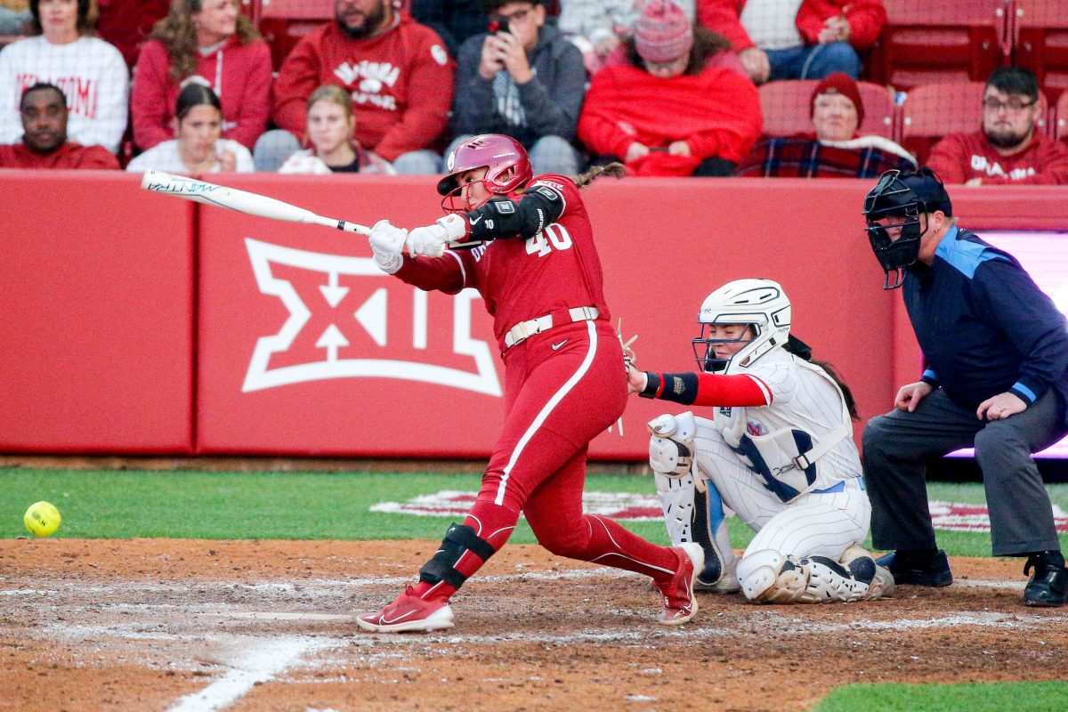 Oklahoma utility Alynah Torres (40) hits a single during an NCAA softball game between Oklahoma (OU) and Liberty on opening day of Oklahoma softball stadium Love's Field in Norman, Okla., on Friday, March 1, 2024.