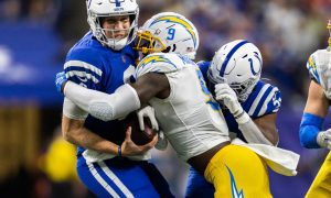 Dec 26, 2022; Indianapolis, Indiana, USA; Los Angeles Chargers linebacker Kenneth Murray Jr. (9) sacks Indianapolis Colts quarterback Nick Foles (9) in the first half at Lucas Oil Stadium. Mandatory Credit: Trevor Ruszkowski-USA TODAY Sports