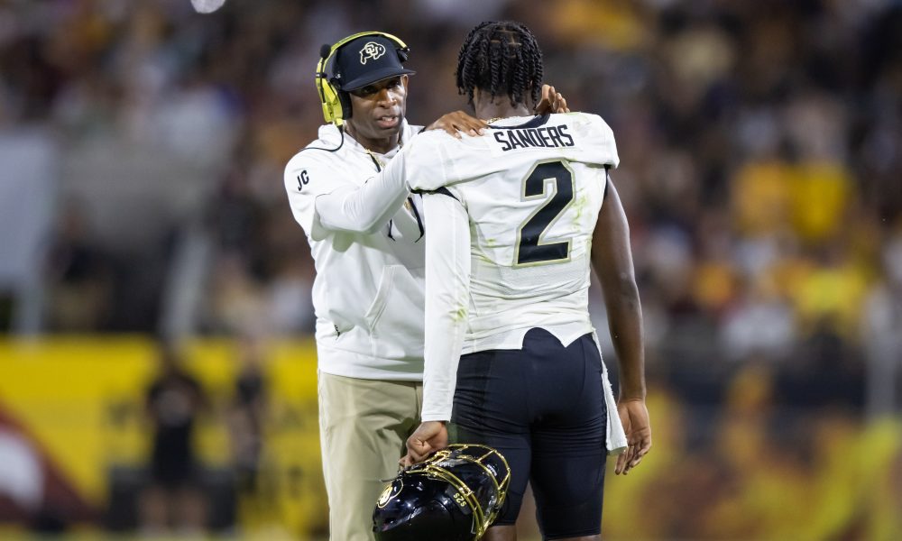 Oct 7, 2023; Tempe, Arizona, USA; Colorado Buffaloes head coach Deion Sanders with son and quarterback Shedeur Sanders (2) against the Arizona State Sun Devils at Mountain America Stadium. Mandatory Credit: Mark J. Rebilas-USA TODAY Sports