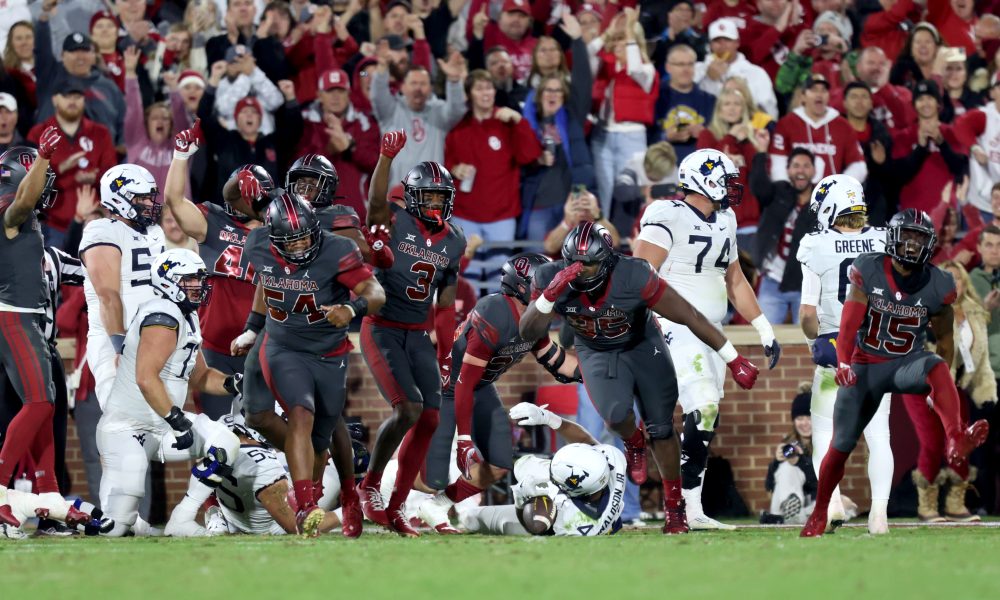 Oklahoma celebrates a goal line defensive stop in the first half of a college football game between the University of Oklahoma Sooners and the West Virginia Mountaineers at Gaylord Family-Oklahoma Memorial Stadium in Norman, Okla., Saturday, Nov., 11, 2023.