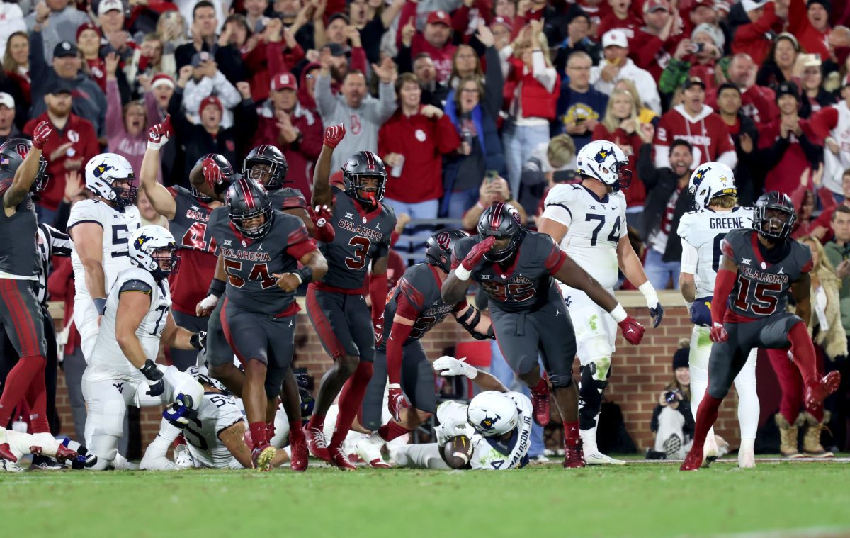 Oklahoma celebrates a goal line defensive stop in the first half of a college football game between the University of Oklahoma Sooners and the West Virginia Mountaineers at Gaylord Family-Oklahoma Memorial Stadium in Norman, Okla., Saturday, Nov., 11, 2023.