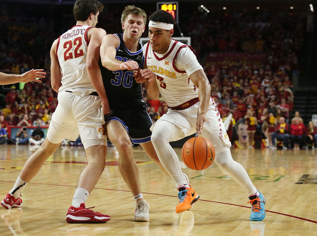 Iowa State Cyclones guard Tamin Lipsey (3) drives to the basket as BYU Cougars guard Dallin Hall (30) defends during the first half in the Senior Day Big-12 conference showdown of an NCAA college basketball at Hilton Coliseum on Wednesday, March 6, 2024, in Ames, Iowa.
