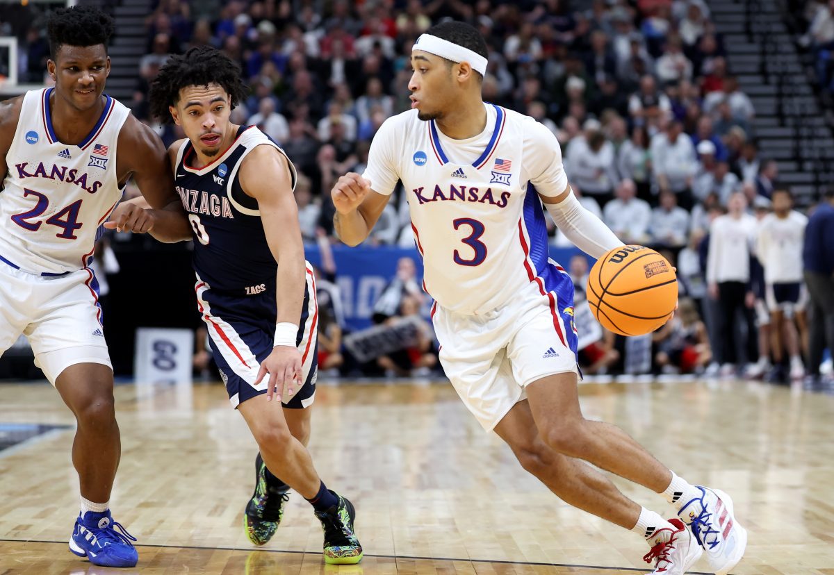 Mar 23, 2024; Salt Lake City, UT, USA; Kansas Jayhawks guard Dajuan Harris Jr. (3) drives against Gonzaga Bulldogs guard Ryan Nembhard (0) during the second half in the second round of the 2024 NCAA Tournament at Vivint Smart Home Arena-Delta Center. Mandatory Credit: Rob Gray-USA TODAY Sports