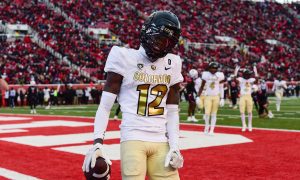 Nov 25, 2023; Salt Lake City, Utah, USA; Colorado Buffaloes athlete Travis Hunter (12) reacts after scoring a touchdown against the Utah Utes at Rice-Eccles Stadium. Mandatory Credit: Christopher Creveling-USA TODAY Sports