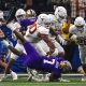 Texas Longhorns defensive lineman Byron Murphy II (90) throws Washington running back Dillon Johnson (7) to the ground during the Sugar Bowl College Football Playoff semifinals game at the Caesars Superdome on Monday, Jan. 1, 2024 in New Orleans, Louisiana.
