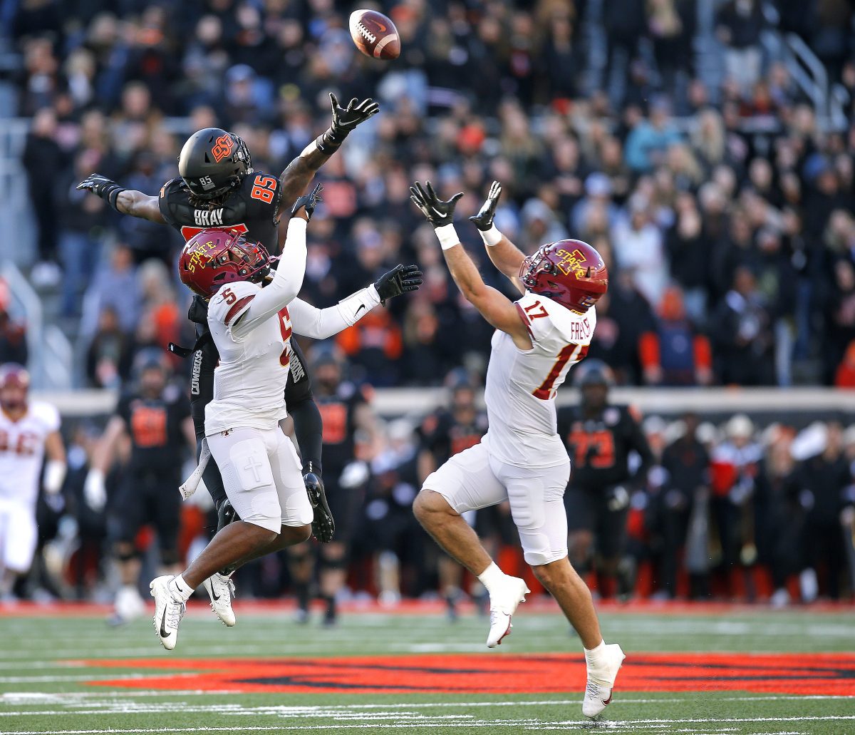 Nov 12, 2022; Stillwater, Oklahoma, USA; Oklahoma State's Jaden Bray (85) can not get to a pass as Iowa State's Beau Freyler (17) prepares to intercept it as Iowa State's Myles Purchase (5) defends in the second quarter during the college football game between the Oklahoma State Cowboys (OSU) and the Iowa State Cyclones at Boone Pickens Stadium. Mandatory Credit: Sarah Phipps-USA TODAY Sports