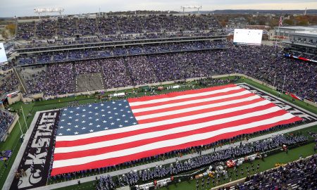 Nov 11, 2023; Manhattan, Kansas, USA; The American flag covers the field before the start of a game between the Baylor Bears and the Kansas State Wildcats at Bill Snyder Family Football Stadium. Mandatory Credit: Scott Sewell-USA TODAY Sports