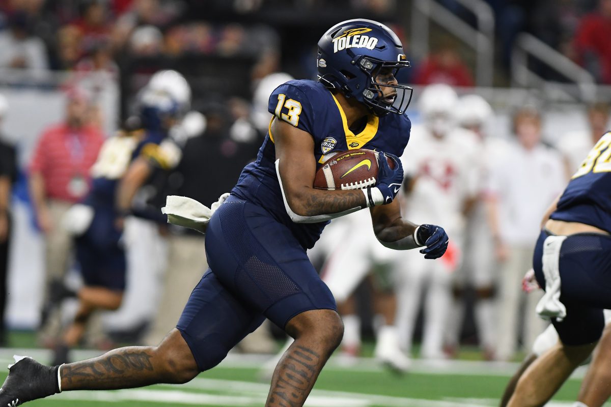 Dec 2, 2023; Detroit, MI, USA; Toledo Rockets running back Peny Boone (13) runs the ball against the Miami (OH) Redhawks in the first quarter at Ford Field. Mandatory Credit: Lon Horwedel-USA TODAY Sports