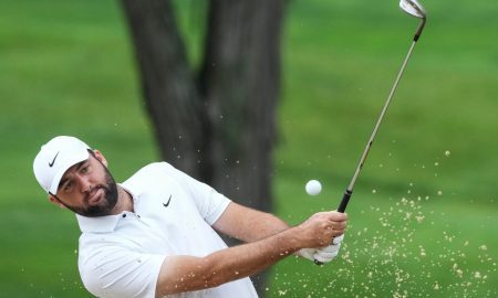 May 15, 2024; Louisville, Kentucky, USA; Scottie Scheffler chips out of a sand trap near the 11th green during a practice round for the PGA Championship golf tournament at Valhalla Golf Club. Mandatory Credit: Matt Stone-USA TODAY Sports