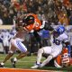 Nov 25, 2023; Stillwater, Oklahoma, USA; Oklahoma State's Ollie Gordon II (0) scores a touchdown in the second overtime against BYU's Eddie Heckard (5) and Crew Wakley (38) at Boone Pickens Stadium. Mandatory Credit: Sarah Phipps-USA TODAY Sports