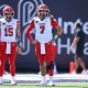 Sep 14, 2024; Logan, Utah, USA; Utah Utes quarterback Cameron Rising (7) watches as his teammates warm up before a game against the Utah State Aggies at Merlin Olsen Field at Maverik Stadium. Mandatory Credit: Jamie Sabau-Imagn Images