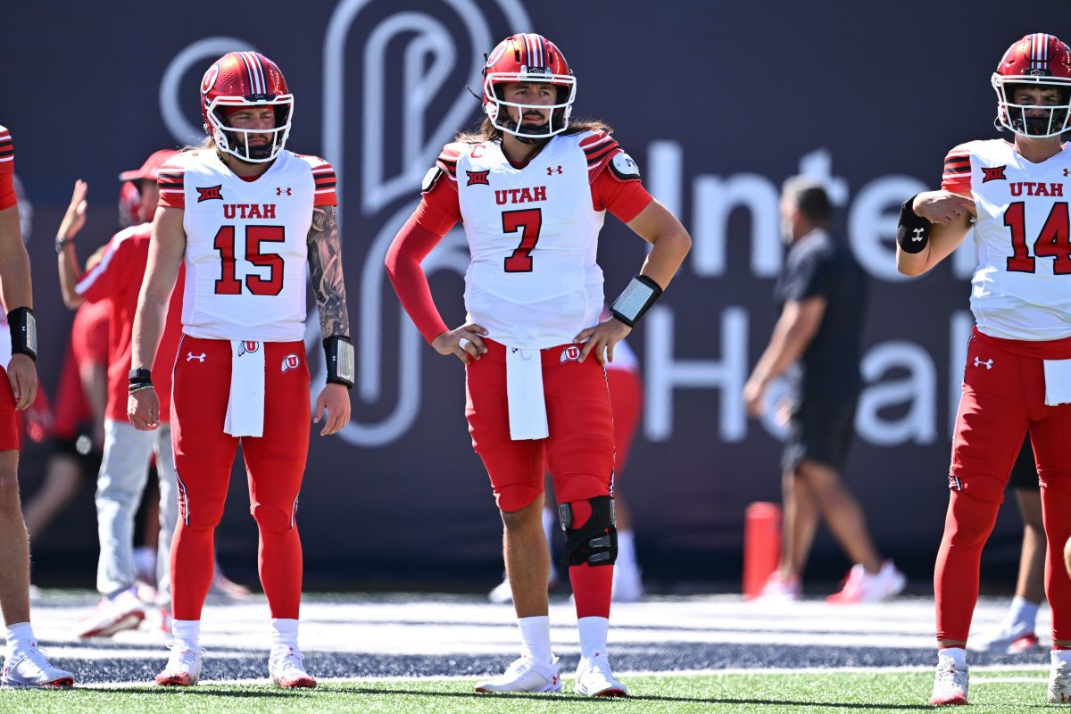 Sep 14, 2024; Logan, Utah, USA; Utah Utes quarterback Cameron Rising (7) watches as his teammates warm up before a game against the Utah State Aggies at Merlin Olsen Field at Maverik Stadium. Mandatory Credit: Jamie Sabau-Imagn Images