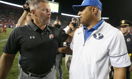 Sep 9, 2017; Provo, UT, USA; Utah Utes head coach Kyle Whittingham (left) and Brigham Young Cougars head coach Kalani Sitake (right) greet each other after Utah defeated BYU at LaVell Edwards Stadium. Mandatory Credit: George Frey-USA TODAY Sports