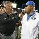Sep 9, 2017; Provo, UT, USA; Utah Utes head coach Kyle Whittingham (left) and Brigham Young Cougars head coach Kalani Sitake (right) greet each other after Utah defeated BYU at LaVell Edwards Stadium. Mandatory Credit: George Frey-USA TODAY Sports