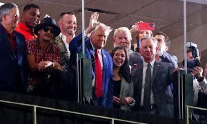 Sep 28, 2024; Tuscaloosa, Alabama, USA; GOP Presidential candidate Donald Trump waves flanked by former Georgia Bulldogs player Herschel Walker, recording art Kid Rock, professional golfer John Daily, Alabama senators Tommy Tuberville (R) and Katie Britt (R) during the second half of the game between the Alabama Crimson Tide and the Georgia Bulldogs at Bryant-Denny Stadium. Mandatory Credit: John David Mercer-Imagn Images