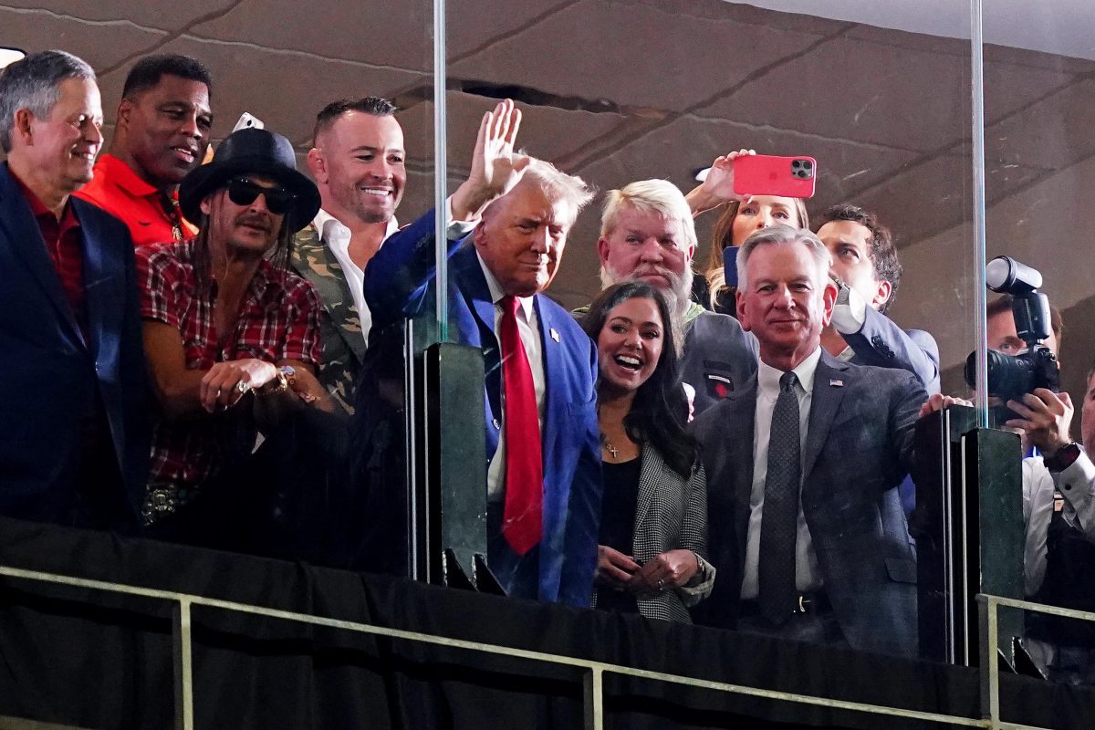 Sep 28, 2024; Tuscaloosa, Alabama, USA; GOP Presidential candidate Donald Trump waves flanked by former Georgia Bulldogs player Herschel Walker, recording art Kid Rock, professional golfer John Daily, Alabama senators Tommy Tuberville (R) and Katie Britt (R) during the second half of the game between the Alabama Crimson Tide and the Georgia Bulldogs at Bryant-Denny Stadium. Mandatory Credit: John David Mercer-Imagn Images