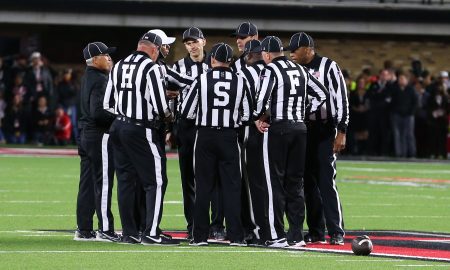 Nov 9, 2024; Lubbock, Texas, USA; The Big 12 officiating crew meet at mid-field in the second half during the game between the Texas Tech Red Raiders and the Colorado Buffalos at Jones AT&T Stadium and Cody Campbell Field. Mandatory Credit: Michael C. Johnson-Imagn Images