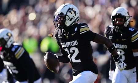 Nov 29, 2024; Boulder, Colorado, USA; Colorado Buffaloes cornerback Travis Hunter (12) following an interception in the first quarter against the Oklahoma State Cowboys at Folsom Field. Mandatory Credit: Ron Chenoy-Imagn Images
