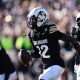 Nov 29, 2024; Boulder, Colorado, USA; Colorado Buffaloes cornerback Travis Hunter (12) following an interception in the first quarter against the Oklahoma State Cowboys at Folsom Field. Mandatory Credit: Ron Chenoy-Imagn Images