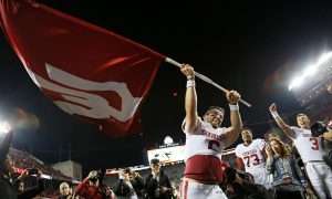 Oklahoma Sooners quarterback Baker Mayfield (6) waves the school flag following their 31-16 win over the Ohio State Buckeyes during NCAA football game at Ohio Stadium in Columbus on Sept. 9, 2017. [Adam Cairns/Dispatch]
