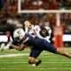 Oct 5, 2024; Tucson, Arizona, USA; Arizona Wildcats defensive back Dalton Johnson (43) tackles Texas Tech Red Raiders quarterback Behren Morton (2) during third quarter at Arizona Stadium. Mandatory Credit: Aryanna Frank-Imagn Images