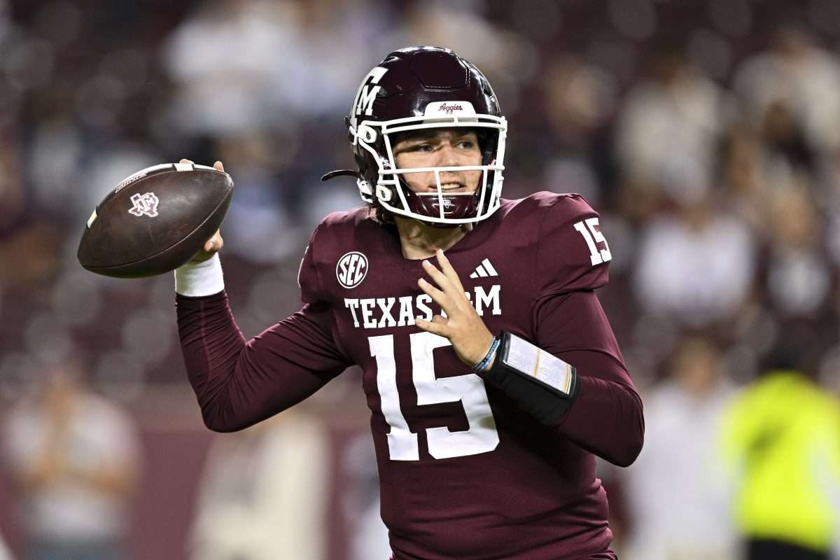 Nov 16, 2024; College Station, Texas, USA; Texas A&M Aggies quarterback Conner Weigman (15) looks to throw the ball during the fourth quarter against the New Mexico State Aggies at Kyle Field. Mandatory Credit: Maria Lysaker-Imagn Images