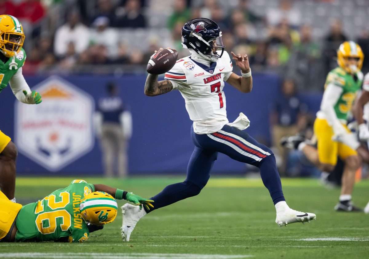 Jan 1, 2024; Glendale, AZ, USA; Liberty Flames quarterback Kaidon Salter (7) against the Oregon Ducks in the 2024 Fiesta Bowl at State Farm Stadium. Mandatory Credit: Mark J. Rebilas-USA TODAY Sports